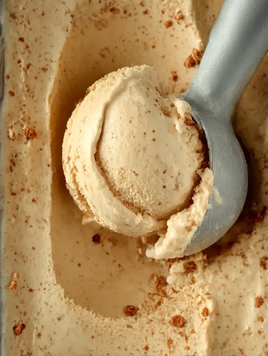 A bowl holding a scoop of ice cream.