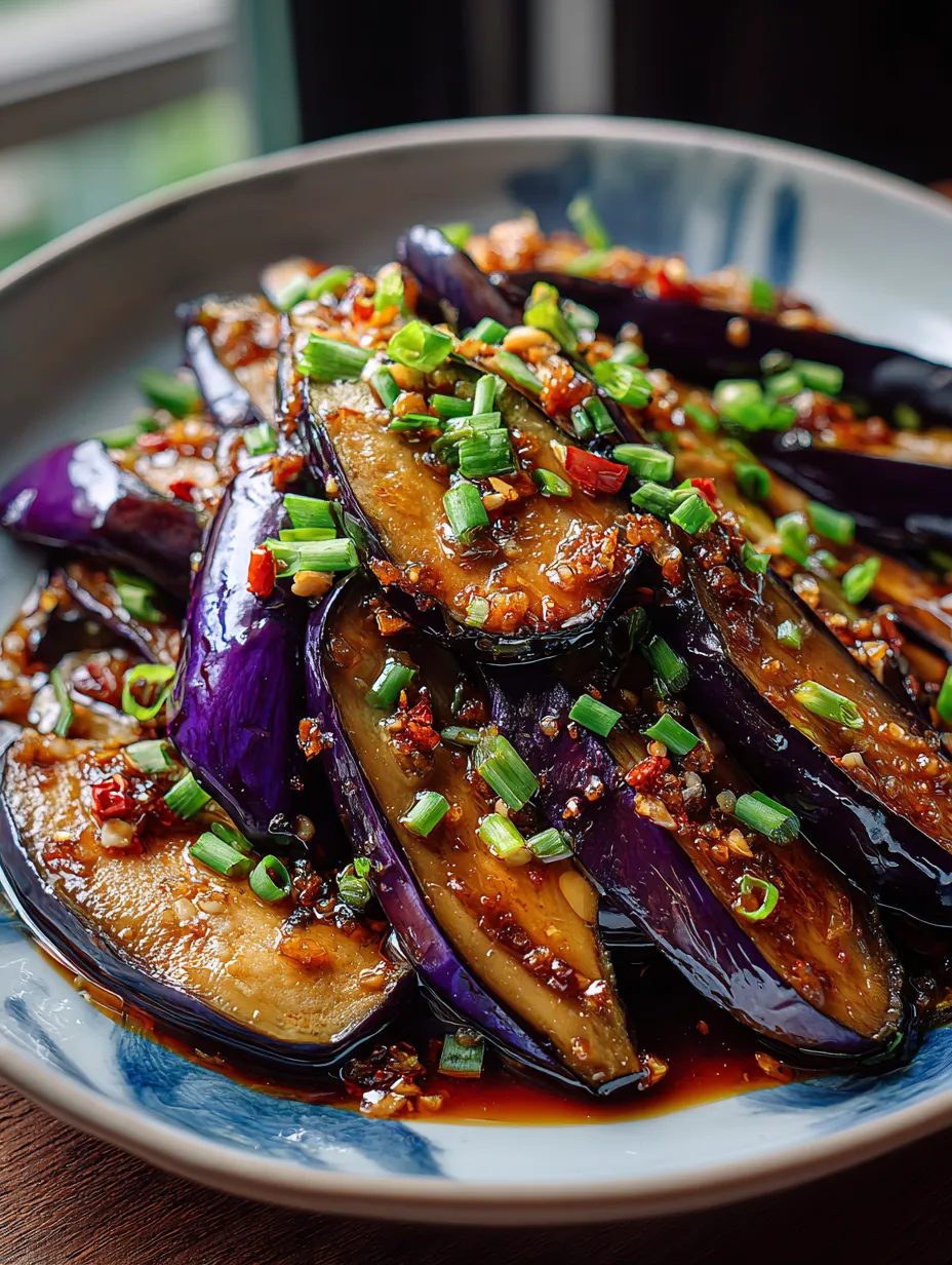 A plate loaded up with Chinese Eggplant in glossy Garlic Sauce.
