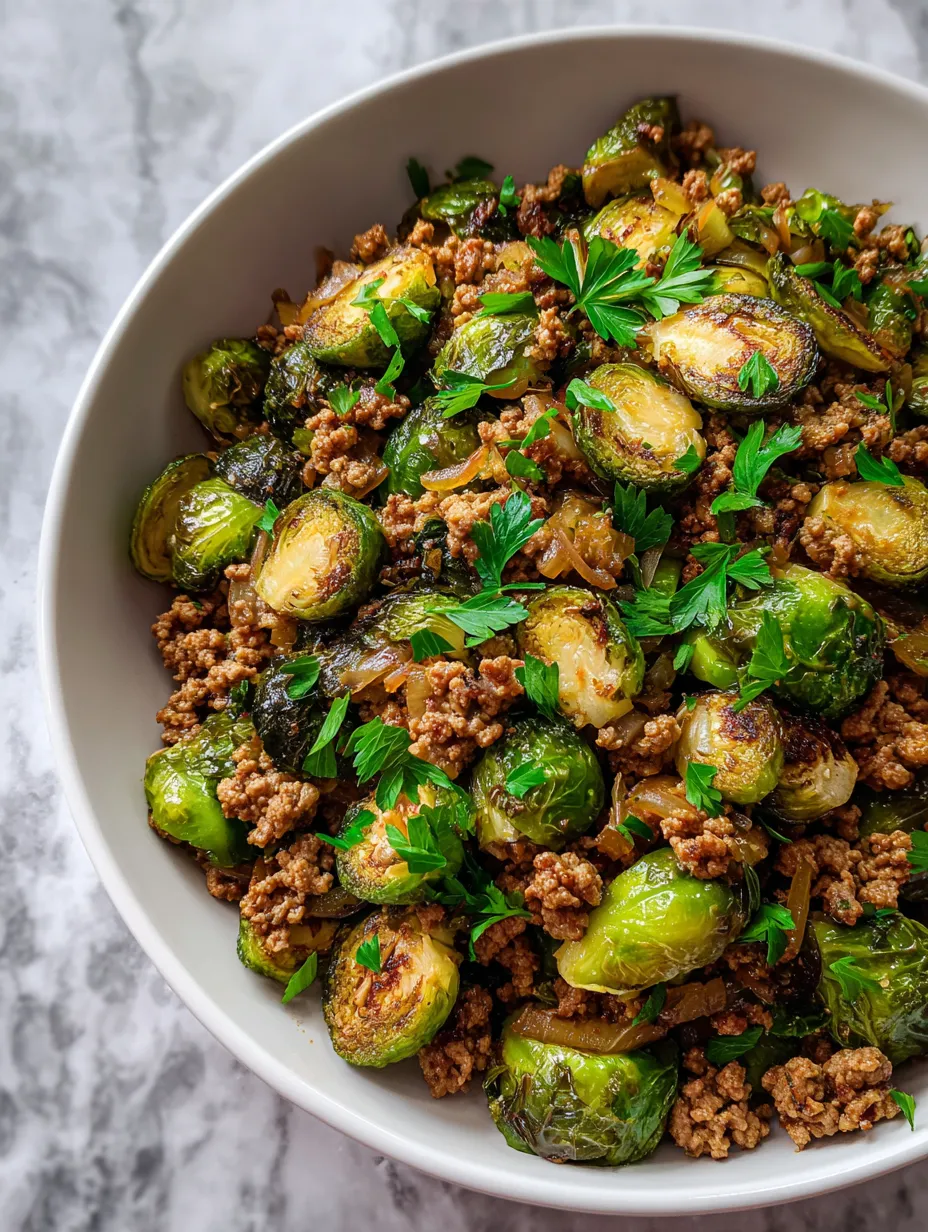 Colorful ground turkey and brussels sprouts skillet in a large serving bowl.